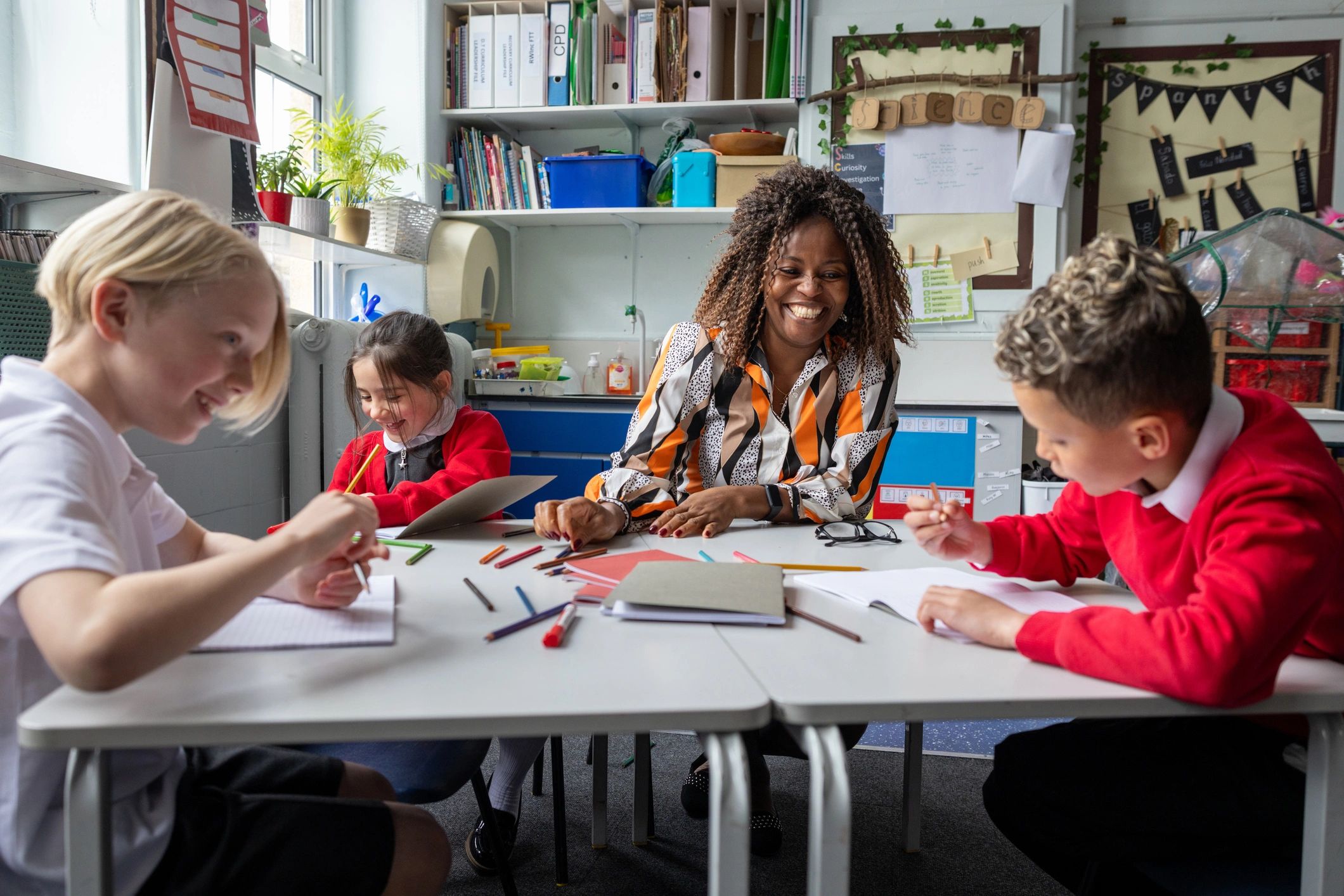 Teacher working with learners during a classroom lesson